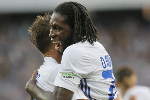 Dynamo Kiev's Dieumerci Mbokani celebrates with his teammate scoring his side's second goal during the Champions League third qualifying round, 1st leg soccer match between Dynamo Kiev and Young Boys at the Olympiyskiy Stadium in Kiev, Ukraine, Wednesday, July 26, 2017. (AP Photo/Efrem Lukatsky)