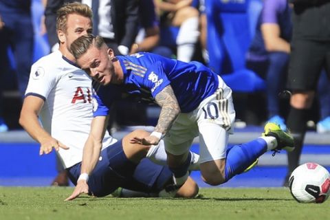 Tottenham's Harry Kane, left, competes for the ball with Leicester's James Maddison during the English Premier League soccer match between Leicester City and Tottenham Hotspur at the King Power Stadium in Leicester, England, Saturday, Sept. 21, 2019. (AP Photo/Leila Coker)