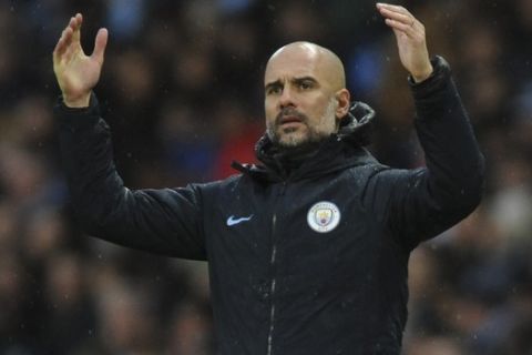 Manchester City manager Josep Guardiola reacts during the FA Cup 4th round soccer match between Manchester City and Burnley at Etihad stadium in Manchester, England, Saturday, Jan. 26, 2019. (AP Photo/Rui Vieira)
