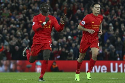 Liverpool's Sadio Mane, left, celebrates after he scores his sides 2nd goal of the game during the English Premier League soccer match between Liverpool and Arsenal at Anfield, in Liverpool, England, Saturday, March 4, 2017.(AP Photo/Dave Thompson)