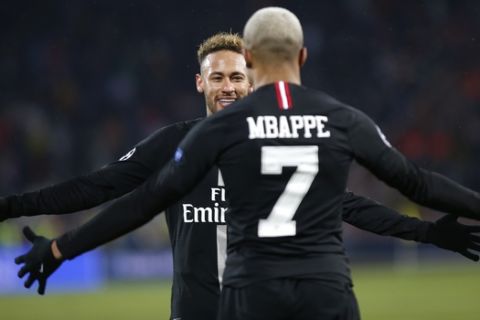 PSG Kylian Mbappe celebrates with teammate Neymar his side's fourth goal during the Champions League group C soccer match between Red Star and Paris Saint Germain, in Belgrade, Serbia, Tuesday, Dec. 11, 2018. (AP Photo/Marko Drobnjakovic)