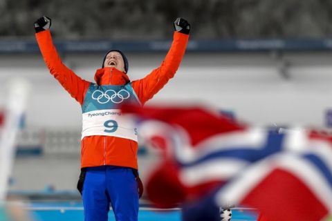 Johannes Thingnes Boe, of Norway, celebrates his gold medal during the venue ceremony after the men's 20-kilometer individual biathlon at the 2018 Winter Olympics in Pyeongchang, South Korea, Thursday, Feb. 15, 2018. (AP Photo/Andrew Medichini)