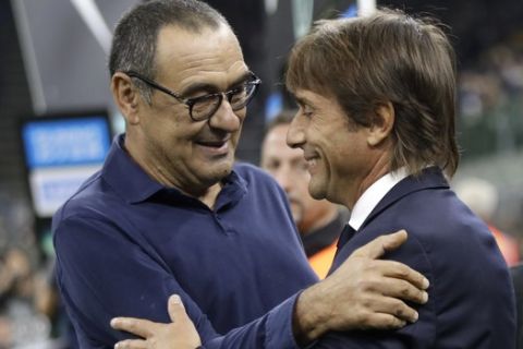 Inter Milan's head coach Antonio Conte and Juventus' head coach Maurizio Sarri, left, prior to the Serie A soccer match between Inter Milan and Juventus, at the San Siro stadium in Milan, Italy, Sunday, Oct. 6, 2019. (AP Photo/Luca Bruno)