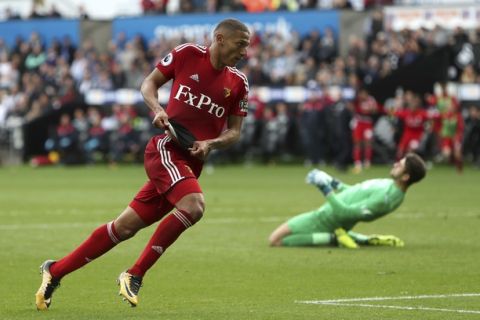 Watford's Richarlison celebrates scoring his side's second goal of the game during their English Premier League soccer match against Swansea City at the Liberty Stadium, Swansea, Wales, Saturday, Sept. 23, 2017. (David Davies/PA via AP)