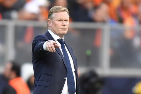 Netherlands coach Ronald Koeman gives instructions from the side line during the UEFA Nations League semifinal soccer match between Netherlands and England at the D. Afonso Henriques stadium in Guimaraes, Portugal, Thursday, June 6, 2019. (AP Photo/Martin Meissner)