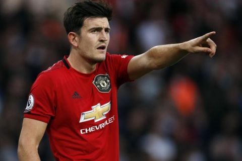 Manchester United's Harry Maguire gestures during the English Premier League soccer match between Wolverhampton Wanderers and Manchester United at the Molineux Stadium in Wolverhampton, England, Monday, Aug. 19, 2019. (AP Photo/Rui Vieira)