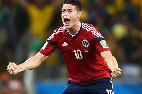 FORTALEZA, BRAZIL - JULY 04:  James Rodriguez of Colombia celebrates scoring his team's first goal on a penalty kick during the 2014 FIFA World Cup Brazil Quarter Final match between Brazil and Colombia at Castelao on July 4, 2014 in Fortaleza, Brazil.  (Photo by Laurence Griffiths/Getty Images)