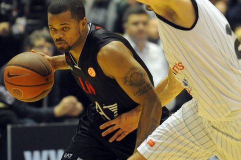 Milan's Omar Cook (L) vies with Partizan Belgrade's Petar Bozic during an Euroleague basketball match at the Pionir Arena in Belgrade on December 22, 2011.   AFP PHOTO / ANDREJ ISAKOVIC (Photo credit should read ANDREJ ISAKOVIC/AFP/Getty Images)