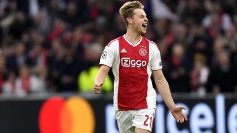 Ajax's Frenkie de Jong celebrates after Ajax's Matthijs de Ligt scoring his side's opening goal during the Champions League semifinal second leg soccer match between Ajax and Tottenham Hotspur at the Johan Cruyff ArenA in Amsterdam, Netherlands, Wednesday, May 8, 2019. (AP Photo/Martin Meissner)