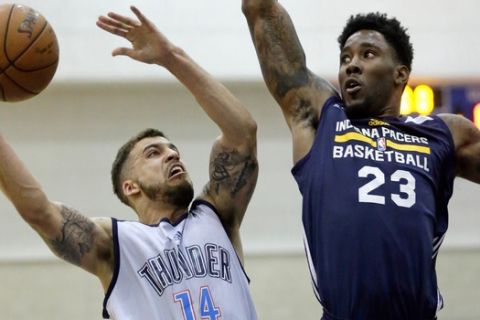 Oklahoma City Thunder's Scottie Wilbekin (14) shoots against Indiana Pacers' Jamari Taylor (23) during the second half of an NBA summer league basketball game Wednesday, July 6, 2016, in Orlando, Fla. (AP Photo/John Raoux)