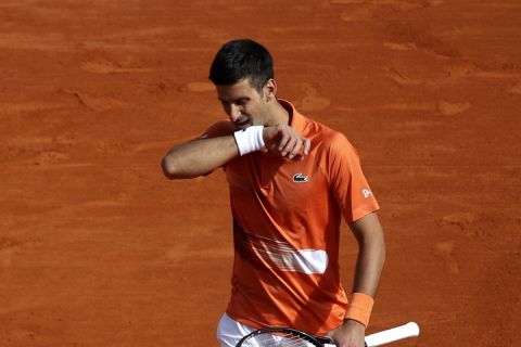 Serbia's Novak Djokovic reacts as he plays Spain's Alejandro Davidovich Fokina during their first round match at the Monte-Carlo Masters tennis tournament, Tuesday, April 12, 2022 in Monaco. (AP Photo/Daniel Cole)