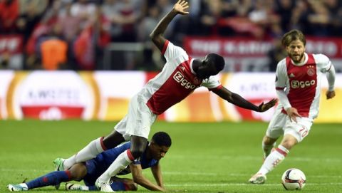 Ajax's Davinson Sanchez trips on United's Marcus Rashford during the soccer Europa League final between Ajax Amsterdam and Manchester United at the Friends Arena in Stockholm, Sweden, Wednesday, May 24, 2017. (AP Photo/Martin Meissner)