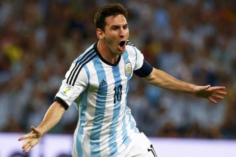 Argentina's Lionel Messi celebrates scoring a goal against Bosnia during their 2014 World Cup Group F soccer match at the Maracana stadium in Rio de Janeiro in this June 15, 2014 file photo. Messi has been shortlisted for the tounrament's "Golden Ball" award for best player.   REUTERS/Michael Dalder/Files (BRAZIL - Tags: SPORT SOCCER WORLD CUP)