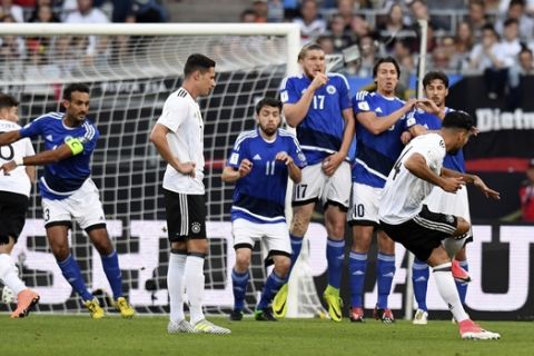 Germany's Emre Can, right, takes a free kick during the World Cup qualifier Group C soccer match between Germany and San Marino at the Stadion Nuernberg in Nuremberg, Germany, Saturday June 10, 2017. (Sven Hoppe/dpa via AP)