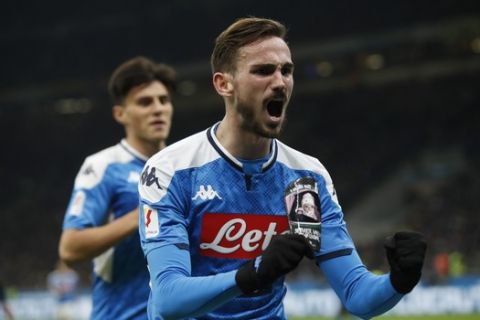 Napoli's Fabian Ruiz celebrates after he scores the opening goal during an Italian Cup soccer match between Inter Milan and Napoli at the San Siro stadium, in Milan, Italy, Wednesday, Feb. 12, 2020. (AP Photo/Antonio Calanni)