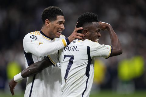Real Madrid's Vinicius Junior, right, celebrates with his teammate Jude Bellingham after scoring his side's opening goal during the Champions League round of 16 second leg soccer match between Real Madrid and RB Leipzig at the Santiago Bernabeu stadium in Madrid, Spain, Wednesday, March 6, 2024. (AP Photo/Manu Fernandez)