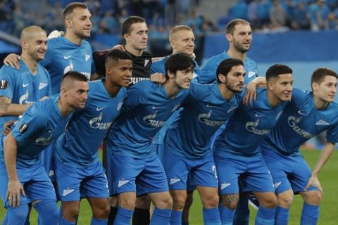Zenit starting players pose for a team photo at the beginning of the Europa League round of 16, 1st leg soccer match between Zenit St.Petersburg and Villarreal at the Saint Petersburg stadium, in St.Petersburg, Russia, Thursday, March 7, 2019. (AP Photo/Dmitri Lovetsky)