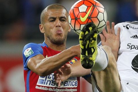 Rosenborg's Matthias Vilhjalmsson, right, challenges for the ball with Steaua's Aymen Tahar, left, during an Europa League Playoffs first leg match at the National Arena Stadium in Bucharest, Romania, Thursday, Aug. 20, 2015.(AP Photo/Vadim Ghirda)