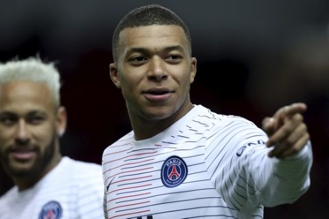 PSG's Kylian Mbappe points his finger during warmup ahead of the French League One soccer match between Monaco and Paris Saint-Germain at the Louis II stadium in Monaco, France, Wednesday, Jan. 15, 2019. (AP Photo/Daniel Cole)