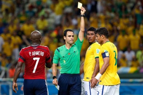 FORTALEZA, BRAZIL - JULY 04: Thiago Silva of Brazil is shown a yellow card by referee Carlos Velasco Carballo during the 2014 FIFA World Cup Brazil Quarter Final match between Brazil and Colombia at Castelao on July 4, 2014 in Fortaleza, Brazil.  (Photo by Gabriel Rossi/Getty Images)
