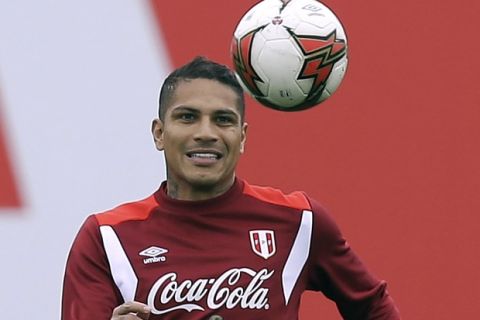 FILE - In this Sunday, Oct. 8, 2017 file photo, Peru's Paolo Guerrero trains for his upcoming World Cup qualifying match in Lima, Peru. Peru captain Paolo Guerrero will be eligible for next year's World Cup after FIFA reduced his suspension for doping from one year to six months. FIFA announced Wednesday, Dec. 20 that its disciplinary committee considered the six-month ban a proportionate sanction "after taking into account all circumstances of the case." (AP Photo/Martin Mejia, file)