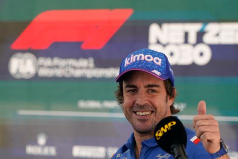 Alpine driver Fernando Alonso, of Spain, reacts after an interview at the Formula One U.S. Grand Prix auto race at Circuit of the Americas, Thursday, Oct. 20, 2022, in Austin, Texas. (AP Photo/Darron Cummings)