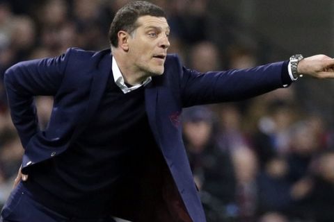 FILE - In this Monday, Jan. 2, 2017 file photo, West Ham United's Slaven Bilic gestures during the English Premier League soccer match between West Ham United and Manchester United at the London stadium, in London. Slaven Bilic was assured Thursday, March 30 that he will remain in charge of West Ham, with the Premier League clubs ownership blaming a tough season on factors out of his control. (AP Photo/Alastair Grant, file)