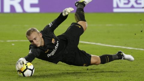 Barcelona goalkeeper Jasper Cillessen makes a save during the second half of the team's International Champions Cup soccer match against Real Madrid, Saturday, July 29, 2017, in Miami Gardens, Fla. Barcelona won 3-2. (AP Photo/Lynne Sladky)