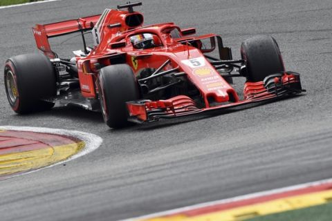 Ferrari driver Sebastian Vettel of Germany steers his car during the Belgian Formula One Grand Prix in Spa-Francorchamps, Belgium, Sunday, Aug. 26, 2018. (AP Photo/Geert Vanden Wijngaert)