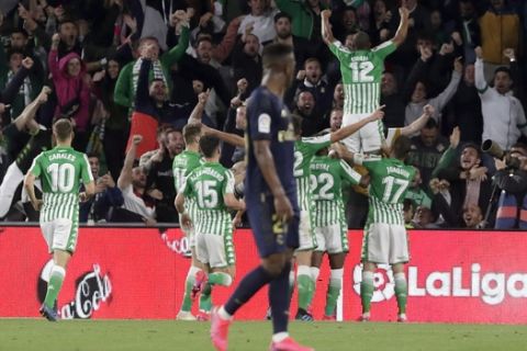 Betis' Sidnei celebrates scoring the opening goal during La Liga soccer match between Betis and Real Madrid at the Benito Villamarin stadium in Seville, Spain, Sunday, March. 8, 2020. (AP Photo/Miguel Morenatti)