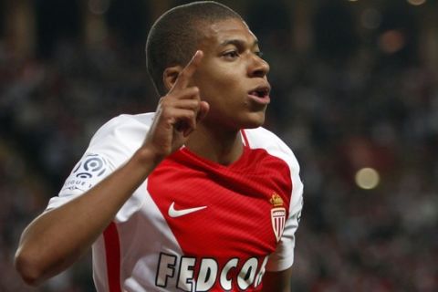 Monaco's forward Kylian MBappe Lottin celebrates his opening goal during the League One soccer match Monaco against Saint Etienne, at the Louis II stadium in Monaco, Wednesday, May 17, 2017. (AP Photo/Claude Paris)