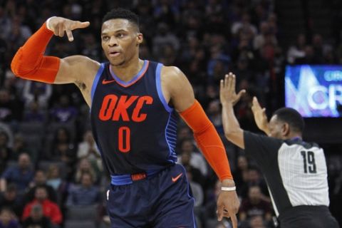 Oklahoma City Thunder guard Russell Westbrook (0) celebrates after hitting a 3-point basket against the Sacramento Kings during the first half of an NBA basketball game in Sacramento, Calif., Wednesday, Dec. 19, 2018. (AP Photo/Steve Yeater)