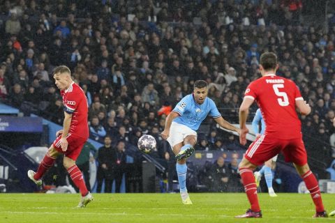 Manchester City's Rodrigo, center, scores his side's opening goal during the Champions League quarterfinal, first leg, soccer match between Manchester City and Bayern Munich at the Etihad stadium in Manchester, England, Tuesday, April 11, 2023. (AP Photo/Jon Super)