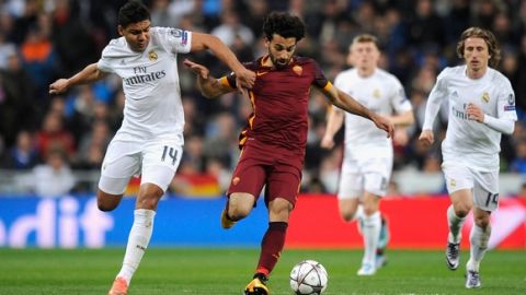 "MADRID, SPAIN - MARCH 08:  Mohamed Salah of Roma is challenged by Casemiro of Real Madrid during the UEFA Champions League Round of 16 Second Leg match between Real Madrid and Roma at Estadio Santiago Bernabeu on March 8, 2016 in Madrid, Spain.  (Photo by Denis Doyle/Getty Images)"
