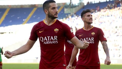 Roma's Kostas Manolas, left, and Lorenzo Pellegrini celebrate their side's 3-1 win at the end of the Serie A soccer match between Roma and Lazio, at the Rome Olympic Stadium, Saturday, Sept. 29, 2018. (AP Photo/Andrew Medichini)