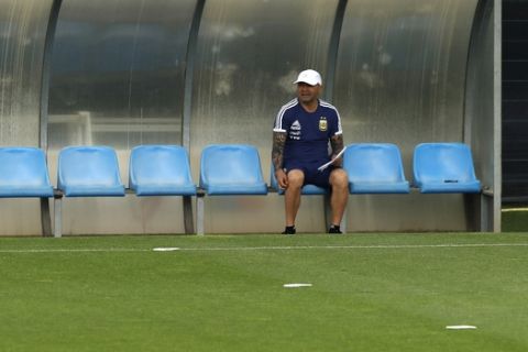 Argentina's coach Jorge Sampaoli sits on a bench during a team training session at the Sports Center FC Barcelona Joan Gamper, in Sant Joan Despi, Spain, Thursday, June 7, 2018. Argentina has called off a World Cup warmup match against Israel following protests by pro-Palestinian groups. A source at Argentina's football federation on Tuesday confirmed the cancellation of the international friendly scheduled to be played Saturday at Teddy Kollek Stadium in Jerusalem. (AP Photo/Manu Fernandez)