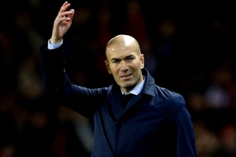 Real Madrid head coach Zinedine Zidane gestures during the Champions League round of sixteen second leg soccer match between Paris St. Germain and Real Madrid at the Parc des Princes stadium in Paris, France, Tuesday, March 6, 2018. (AP Photo/Christophe Ena)