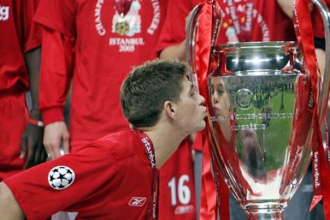 FILE - In this Wednesday, May 25, 2005 file photo, Liverpool's captain Steven Gerrard kisses the trophy after Liverpool beat AC Milan on penalties to win the Champions League final at the Ataturk Olympic Stadium in Istanbul. Gerrard, the former Liverpool and England captain, announced his retirement from professional soccer on Thursday, Nov. 24, 2016 and said he is considering a "number of options" about his next career move. (AP Photo/Thomas Kienzle, File)