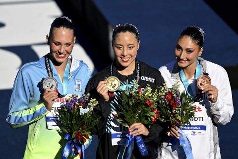 Ukraine's Marta Fedina (left to right), Japan's Yukiko Inui, Greece's Evangelia Platanioti pose with their medals after the solo technical final of artistic swimming at the 19th FINA World Championships in Budapest, Hungary, Saturday, June 18, 2022. (AP Photo/Anna Szilagyi)