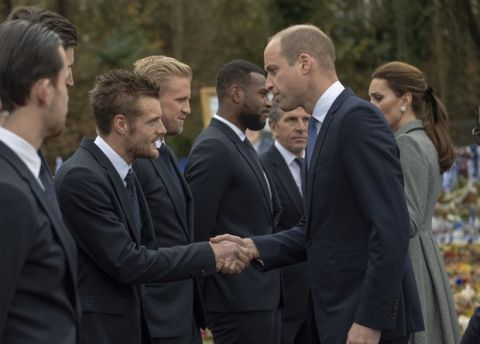 Britain's Prince William shakes hands with Leicester City striker Jamie Vardy during a visit to pay tribute to those who were killed in an helicopter crash at Leicester City Football Club's King Power Stadium in Leicester, England, Wednesday, Nov. 28, 2018. Vichai Srivaddhanaprabha, the Thai billionaire owner of Premier League team Leicester City was among five people who died after his helicopter crashed and burst into flames shortly after taking off from the soccer field on Saturday Oct. 27, 2018. (Arthur Edwards/Pool via AP)