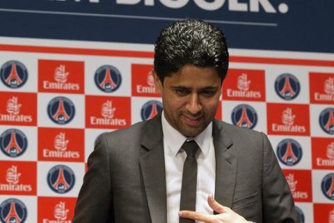 FILE - In this May 17, 2013 file photo, Paris Saint-Germain soccer club President Nasser Al-Khelaifi, arrives to speak to the media during a press conference at Parc des Princes stadium in Paris. Swiss federal prosecutors have announced Thursday Oct.12, 2017 a criminal case for suspected bribery linked to World Cup broadcast rights against Nasser Al-Khelaifi. (AP Photo/Michel Euler)