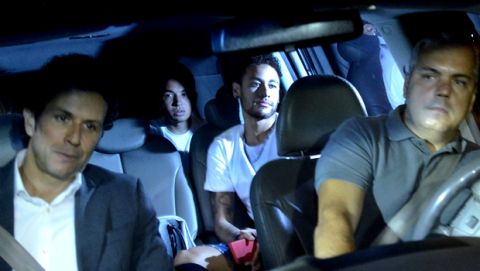 Brazil soccer star Neymar, second right, arrives to the Mater Dei Hospital, in Belo Horizonte, Brazil, Friday, March 2, 2018. Neymar will have surgery on a fractured toe in his right foot and could be out for up to three months, an estimate that would take the Brazil striker right up to the World Cup. Neymar was injured Sunday in Paris Saint-Germain's match against Marseille in the French league. (AP Photo/Eugenio Savio)