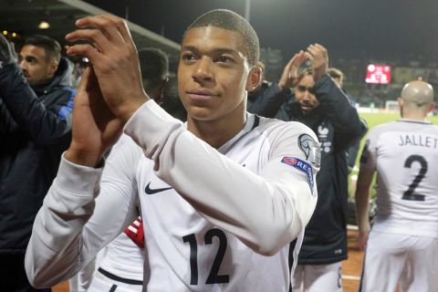 France's Kylian Mbappe celebrates after defeating Luxembourg during the World Cup 2018 Group A qualifying soccer match at the Josy Barthel stadium in Luxembourg on Saturday, March 25, 2017. (AP Photo/Olivier Matthys)