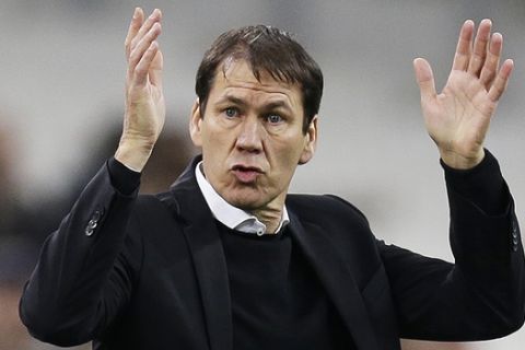 FILE - In this Tuesday, Jan. 16, 2018 file photo, Marseille's coach Rudi Garcia directs his players during the League One soccer match between Marseille and Strasbourg, at the Velodrome stadium, in Marseille, southern France. Marseille will play Atletico Madrid in the Europa League final on Wednesday May 16, 2018. Marseille now enjoys significant financial backing and the time is right to stop harping on about past glory and deliver another trophy. Atletico is bidding to win the Europa League for the third time this decade. (AP Photo/Claude Paris, File)