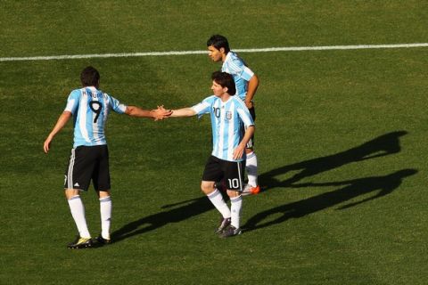 JOHANNESBURG, SOUTH AFRICA - JUNE 17:  Lionel Messi congratulates team mate Gonzalo Higuain of Argentina during the 2010 FIFA World Cup South Africa Group B match between Argentina and South Korea at Soccer City Stadium on June 17, 2010 in Johannesburg, South Africa.  (Photo by Cameron Spencer/Getty Images)