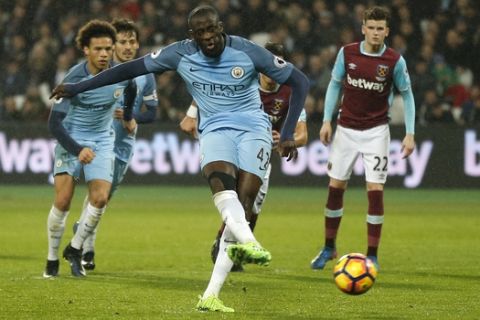 Manchester City's Yaya Toure scores a goal from a penalty during the English Premier League soccer match between West Ham and Manchester City at the London stadium, Wednesday, Feb. 1, 2017. (AP Photo/Frank Augstein)