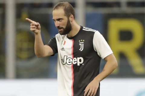 Juventus' Gonzalo Higuain celebrates after scoring his side's second goal during a Serie A soccer match between Inter Milan and Juventus, at the San Siro stadium in Milan, Italy, Sunday, Oct. 6, 2019. (AP Photo/Luca Bruno)