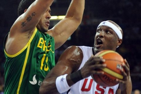 Lamar Odom (R) of USA vies with Joao Batista (L) of Brazil during the preliminary round group B match between Brazil and USA, at the FIBA World Basketball Championships at the Abdi Ipekci Arena in Istanbul, on August 30, 2010. AFP PHOTO / MUSTAFA OZER (Photo credit should read MUSTAFA OZER/AFP/Getty Images)