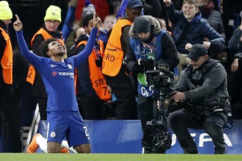 Chelsea's Willian celebrates after scoring the opening goal of his team during the Champions League, round of 16, first-leg soccer match between Chelsea and Barcelona at Stamford Bridge stadium, Tuesday, Feb. 20, 2018. (AP Photo/Frank Augstein)