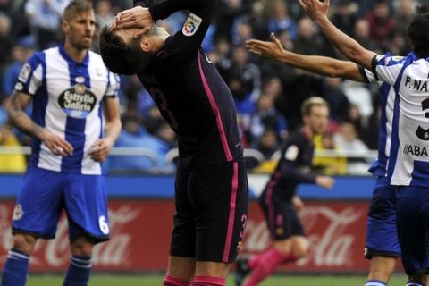Barcelona's Gerard Pique, centre, reacts after missing a shot during a Spanish La Liga soccer match between Deportivo and Barcelona at the Riazor stadium in A Coruna, Spain, Sunday, March 12, 2017. Deportivo won 2-1. (AP Photo/Paulo Duarte)